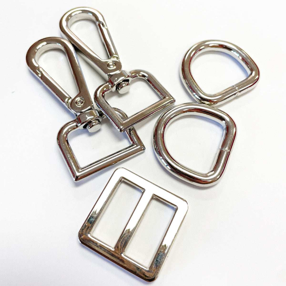 Silver metal hardware pieces.