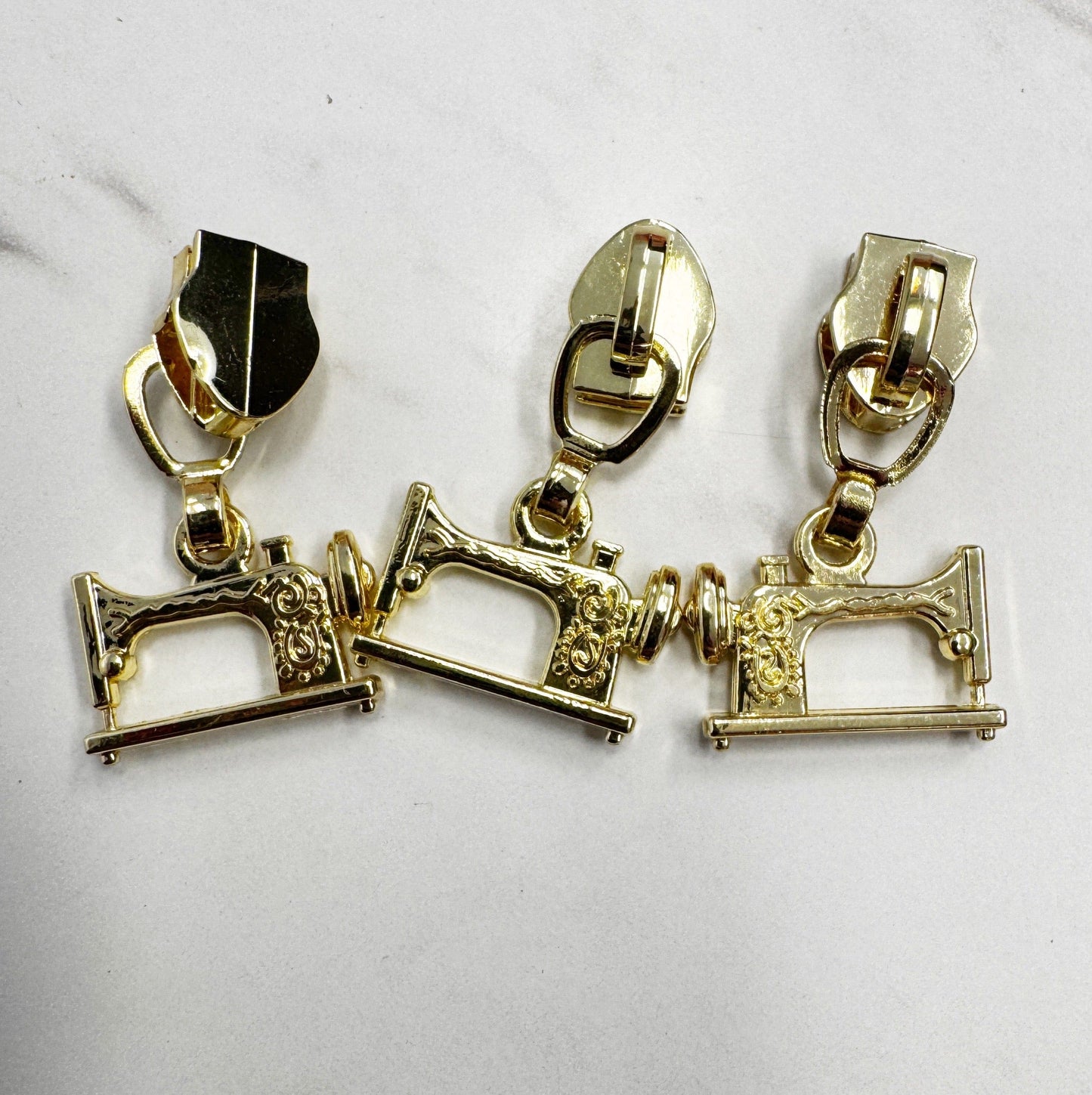 Gold sewing machine zipper pulls (11DF314C-55CD)