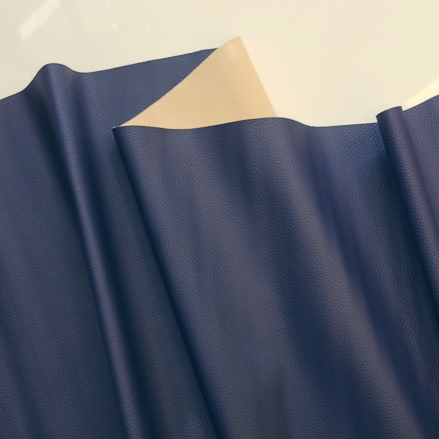 Blue fabric with beige backing