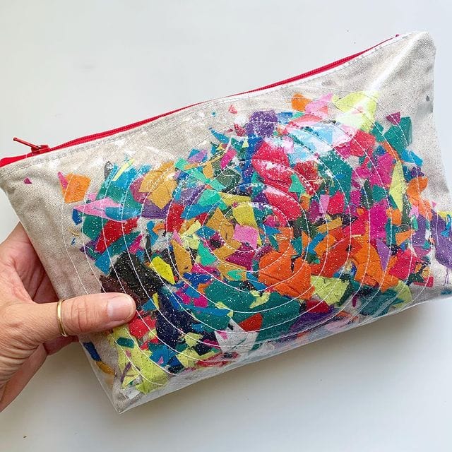 Clear pouch filled with colorful confetti.