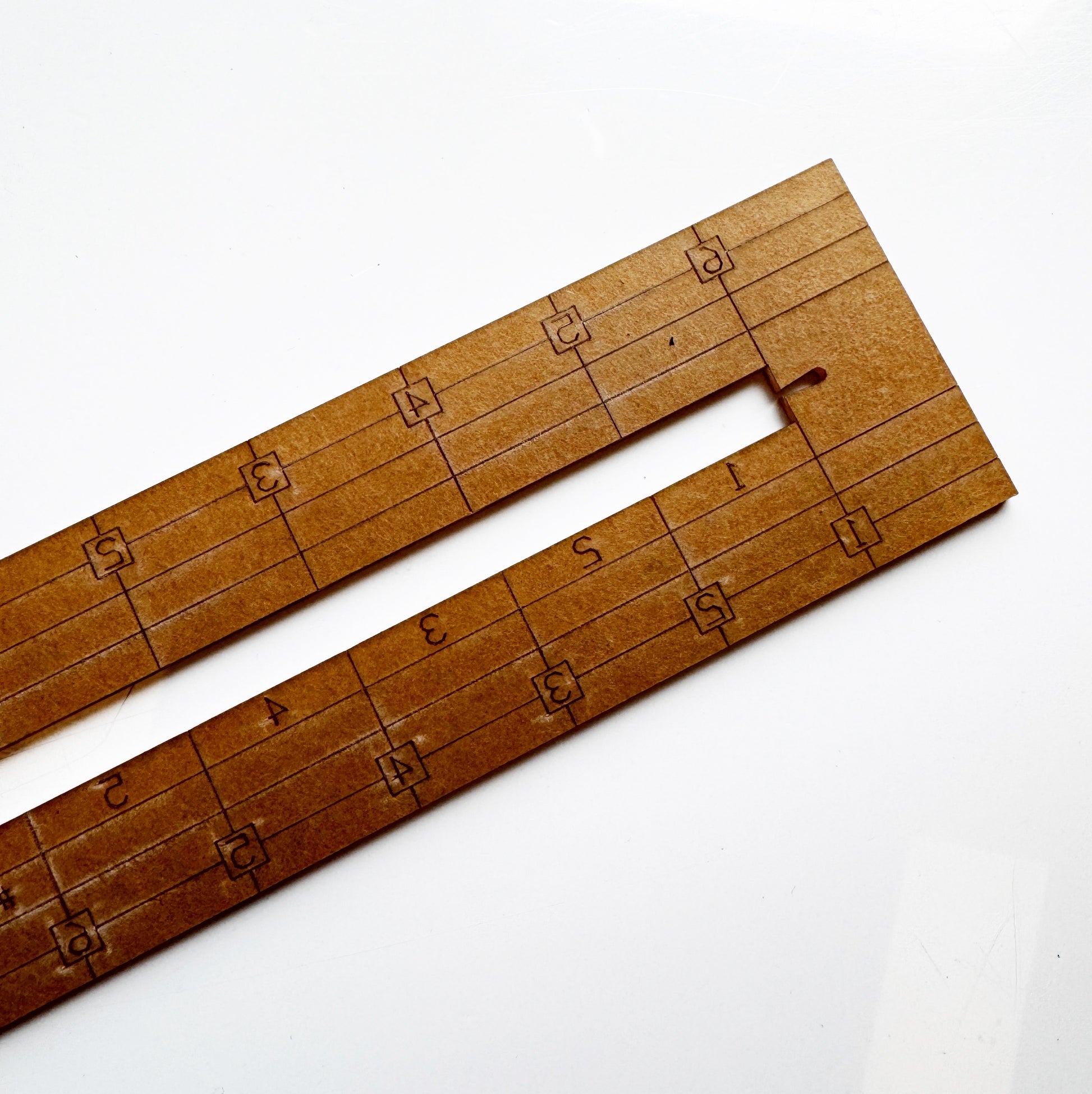 Brown ruler with measurements (3ED159CD-52A2)