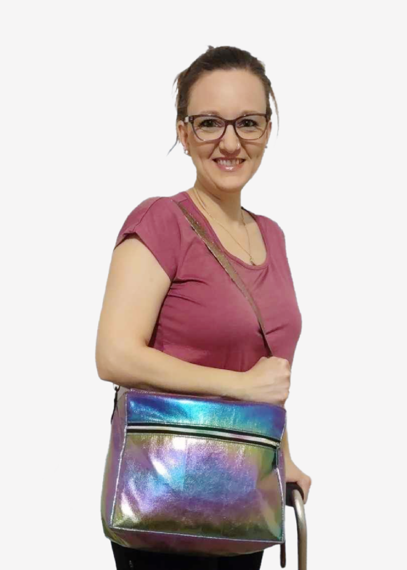 Woman with glasses holding a colorful iridescent shoulder bag.