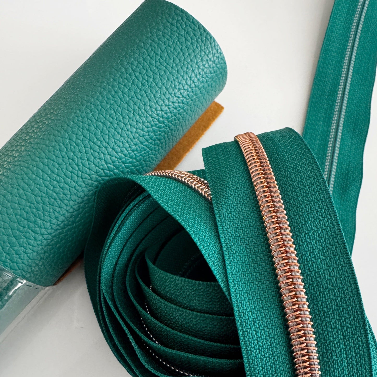 Teal leather roll & copper zipper detail (9B1E8FAE)