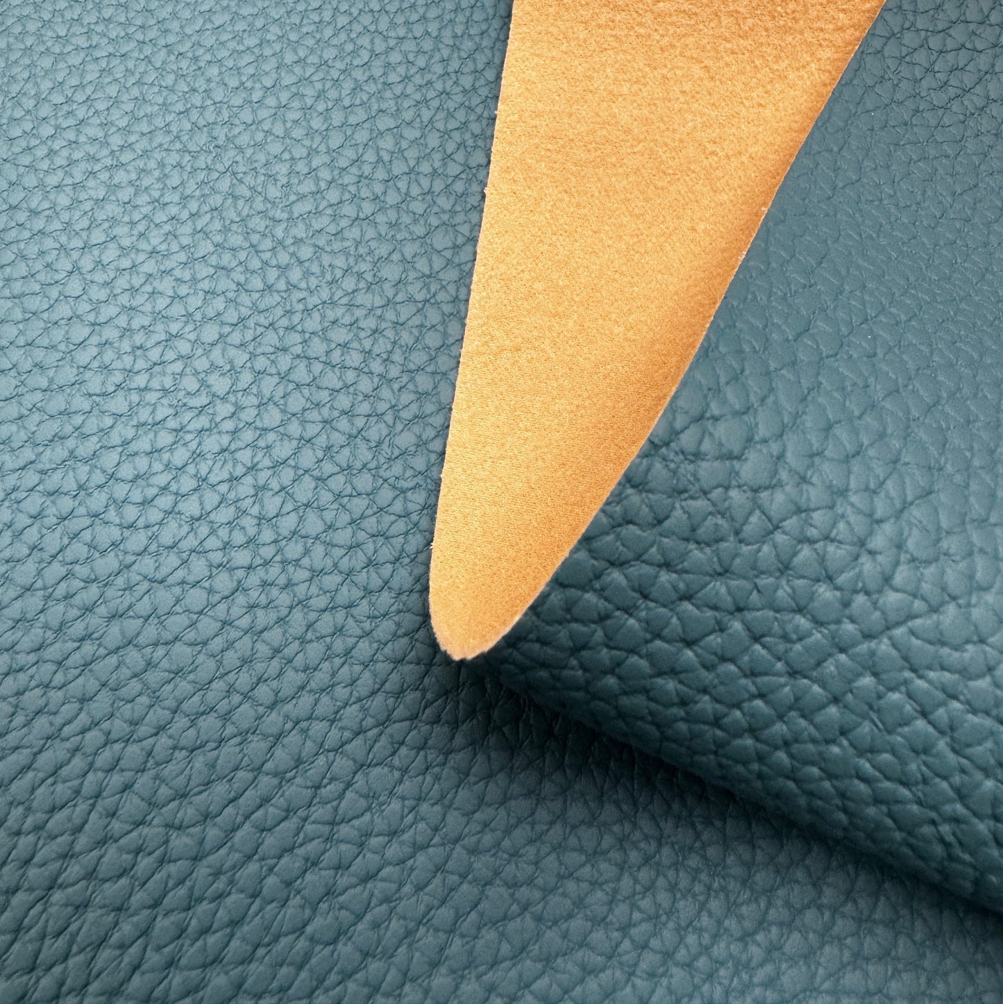 Teal leather swatch with tan underside, 9B3C1269