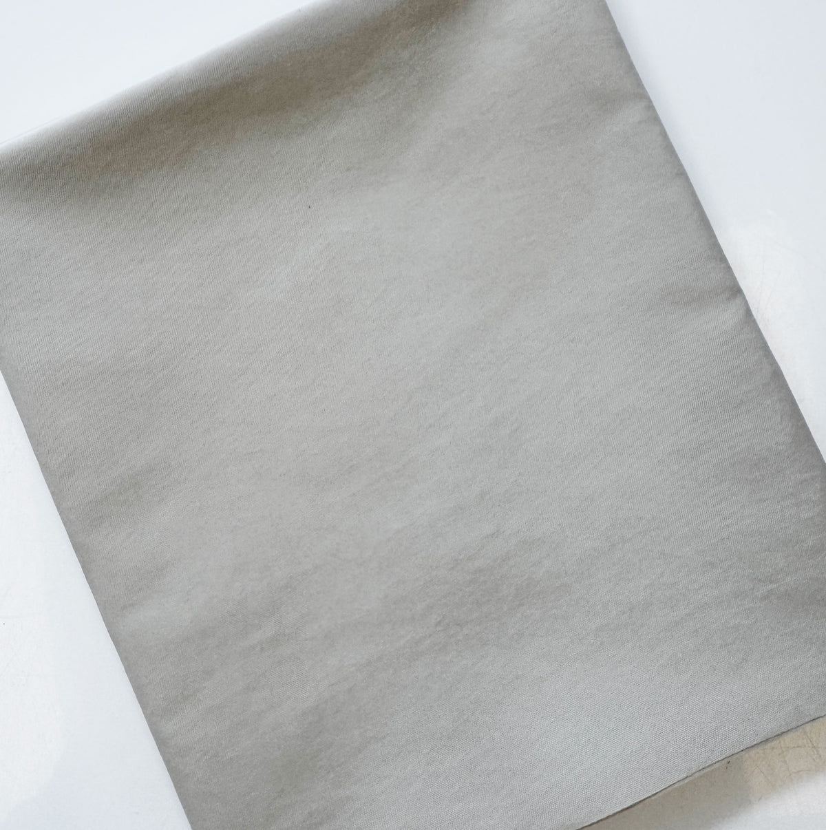 Folded beige nylon lining fabric