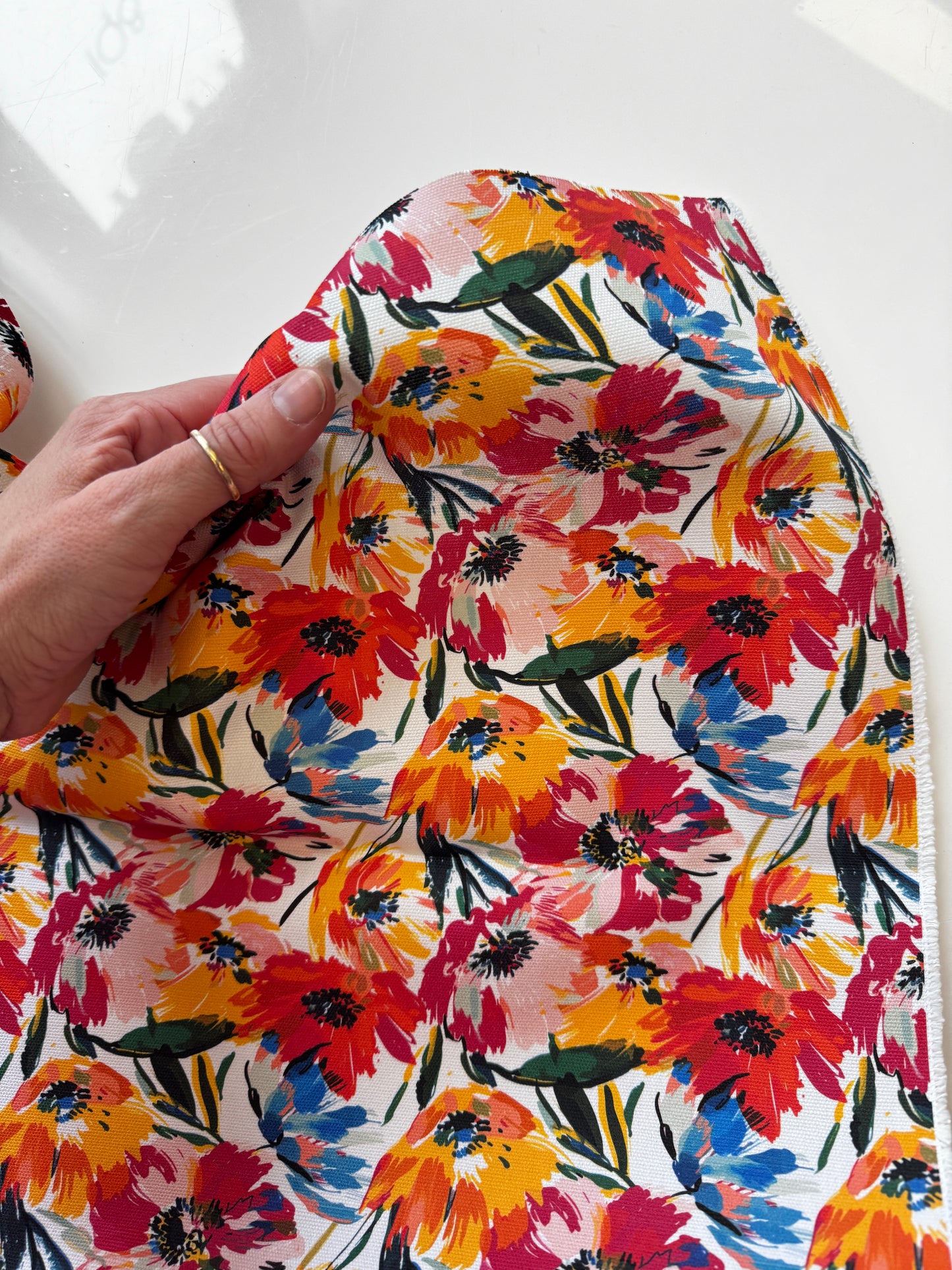 Floral fabric with red, orange, and yellow flowers, AE1FF6E9-2A29