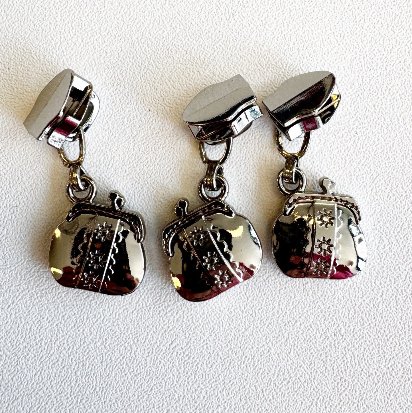 Silver purse zipper pulls