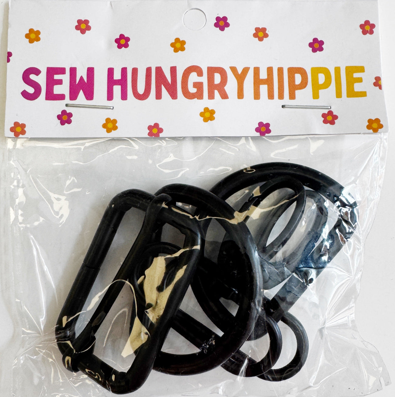 Black 1.5-inch width, 5-piece hardware set by Sew HungryHippie in plastic packaging.