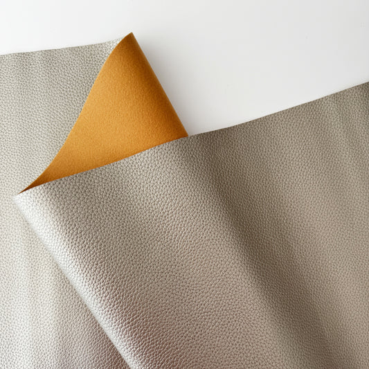 Gray textured fabric with tan underside