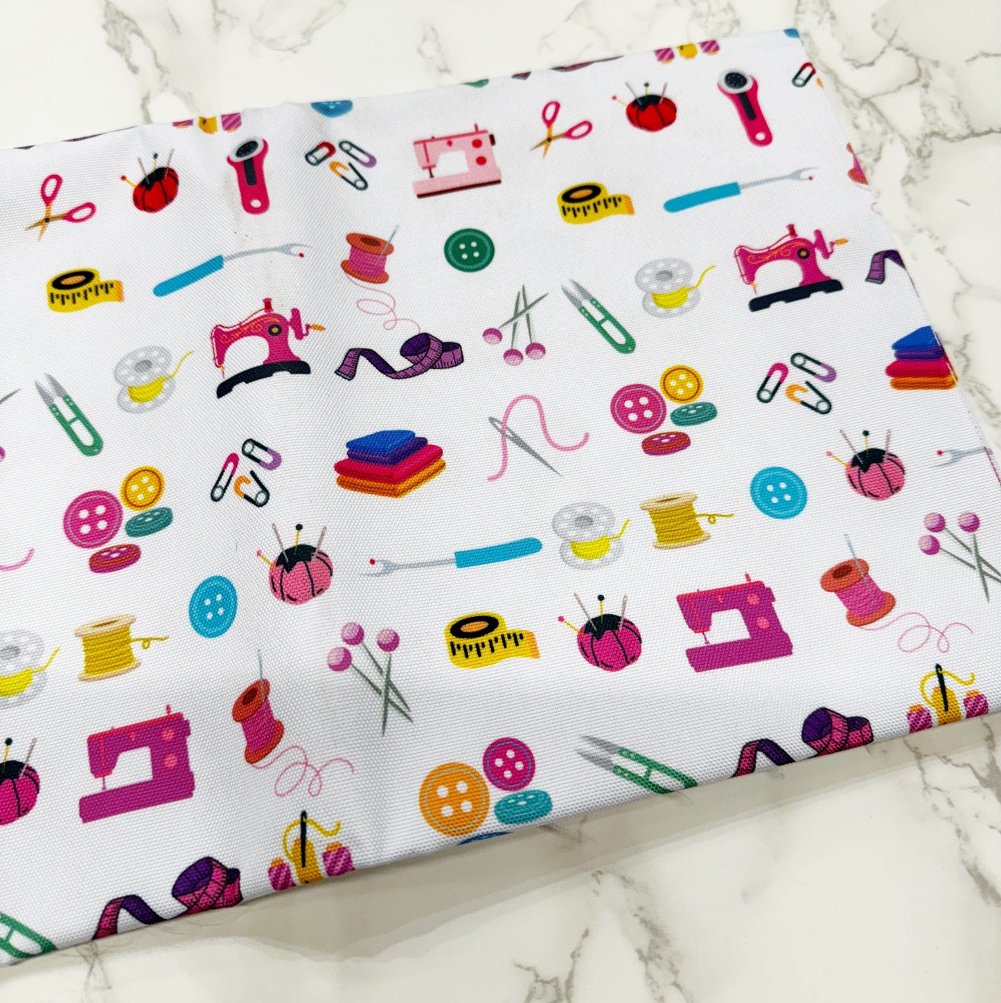 Sewing themed fabric with sewing tools pattern.