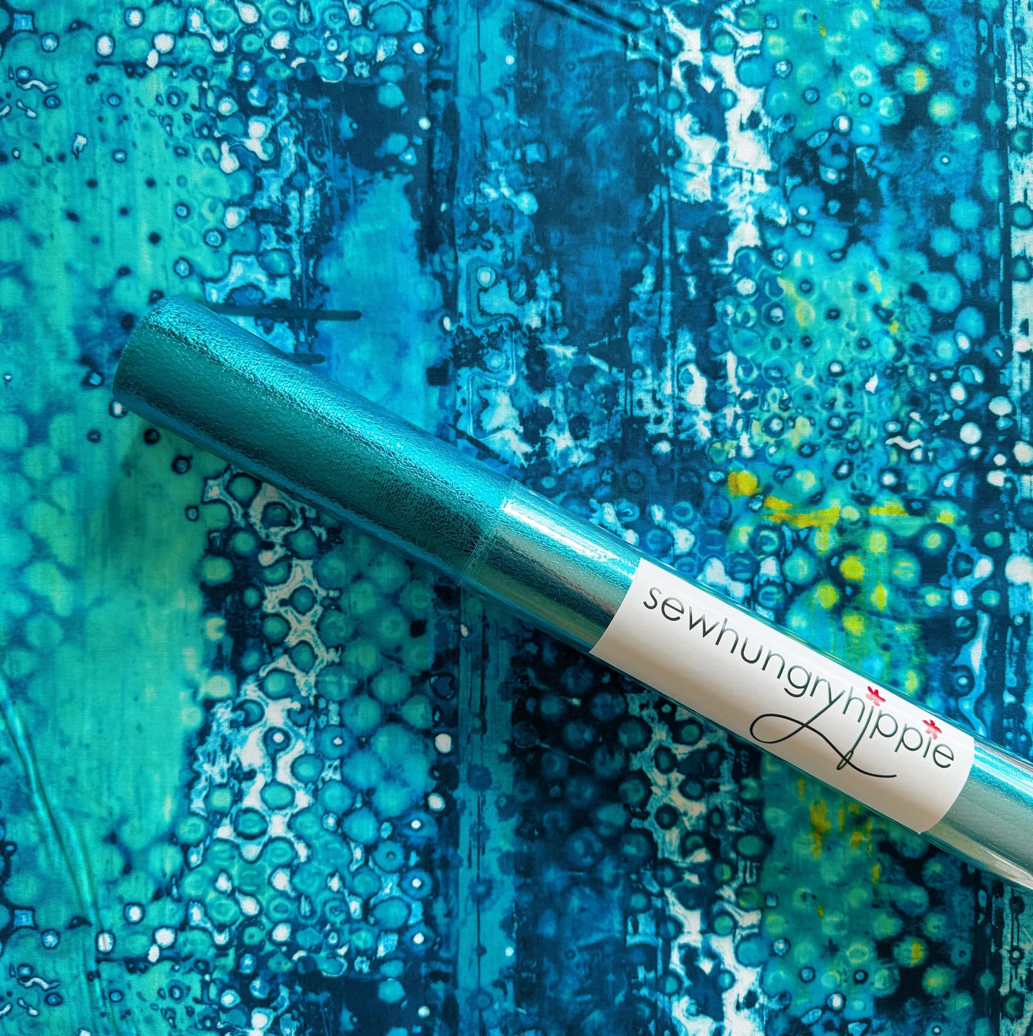Sewhungryhippie teal craft roll on blue abstract background
