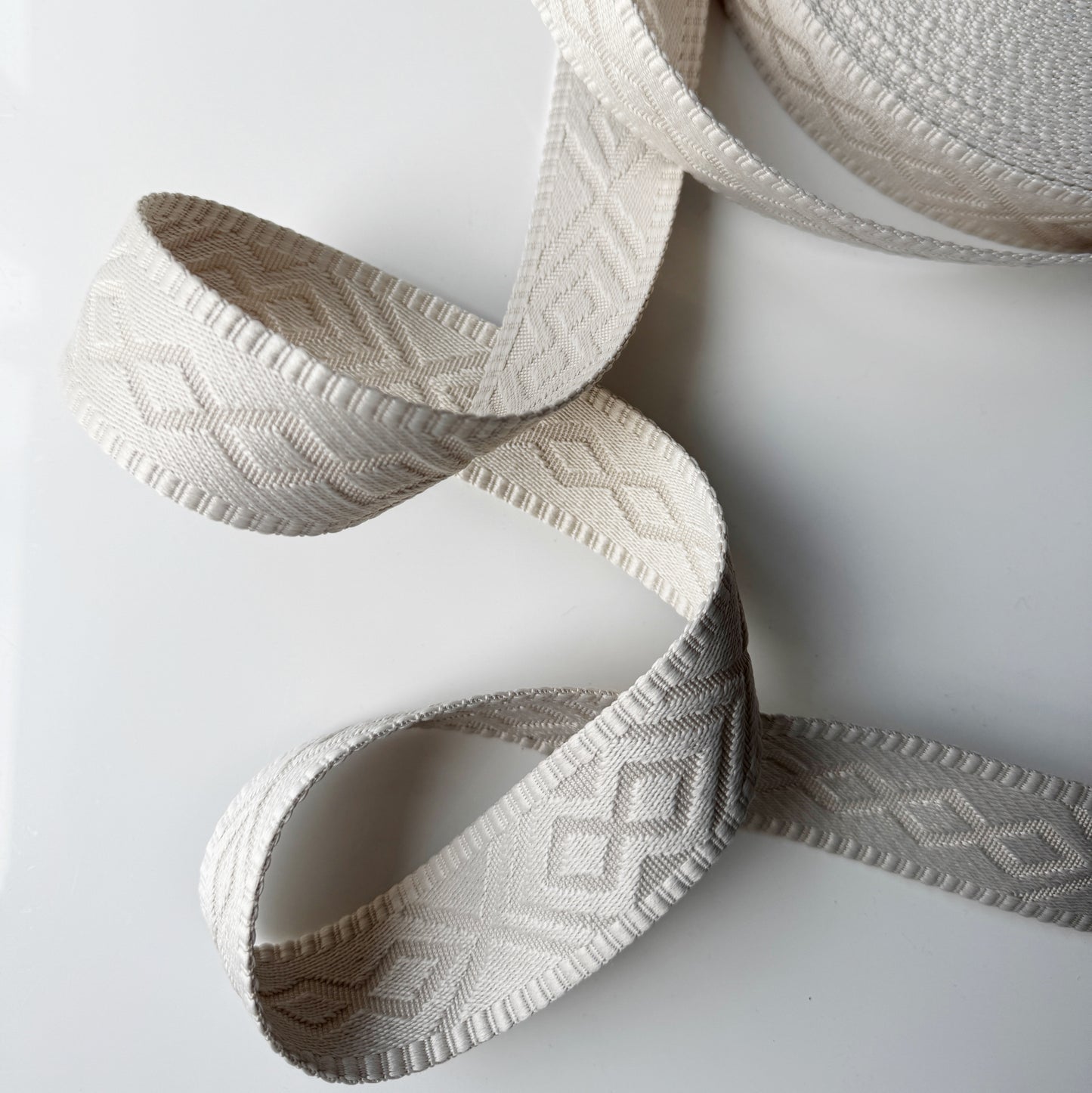 Cream diamond patterned ribbon roll, F7E06E0A-23BF-40E3-A237-14DCBF5B896B