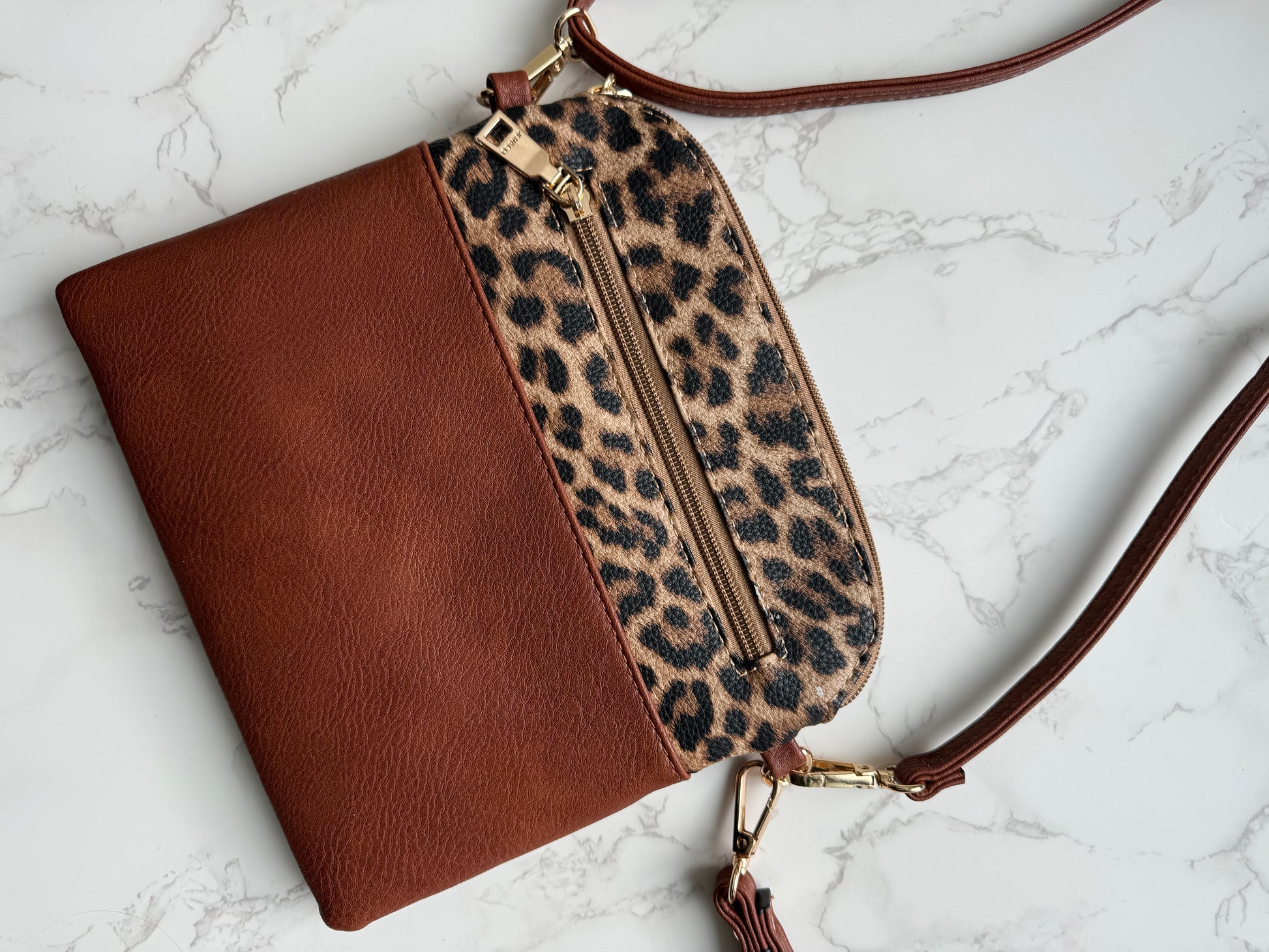 Brown and leopard print crossbody bag.