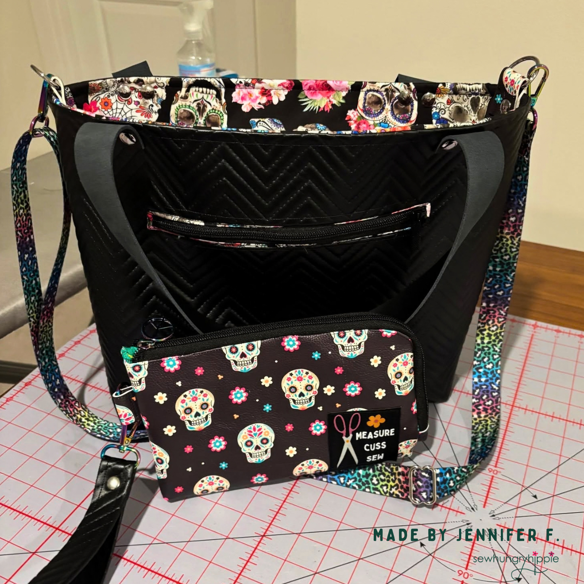 Black chevron quilted vinyl bag with sugar skull lining, matching pouch and rainbow leopard webbing strap, made by Jennifer F.