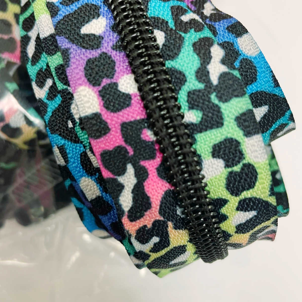 Black leopard rainbow zipper close-up