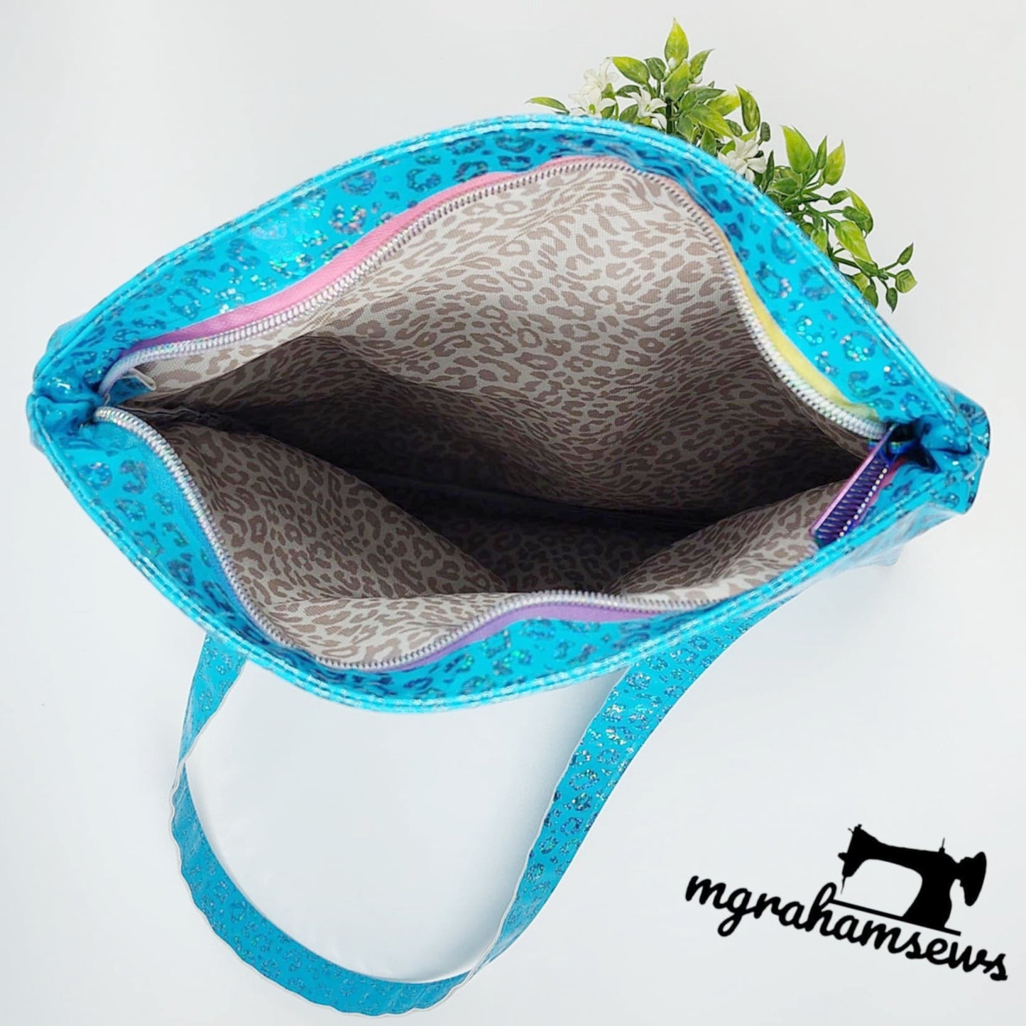 Carly tote bag inside view with leopard print lining.