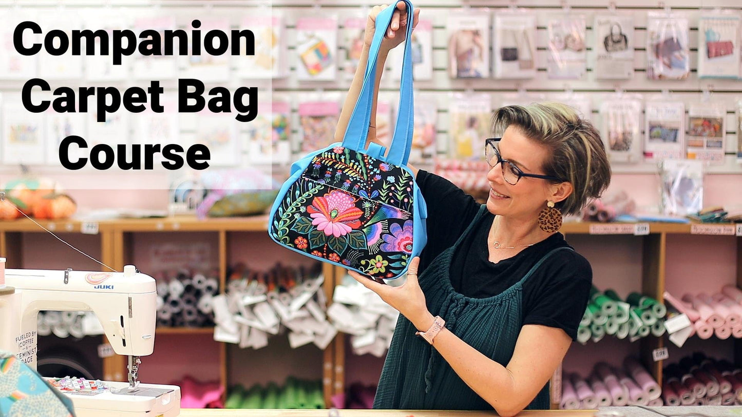 Woman holding colorful carpet bag from course
