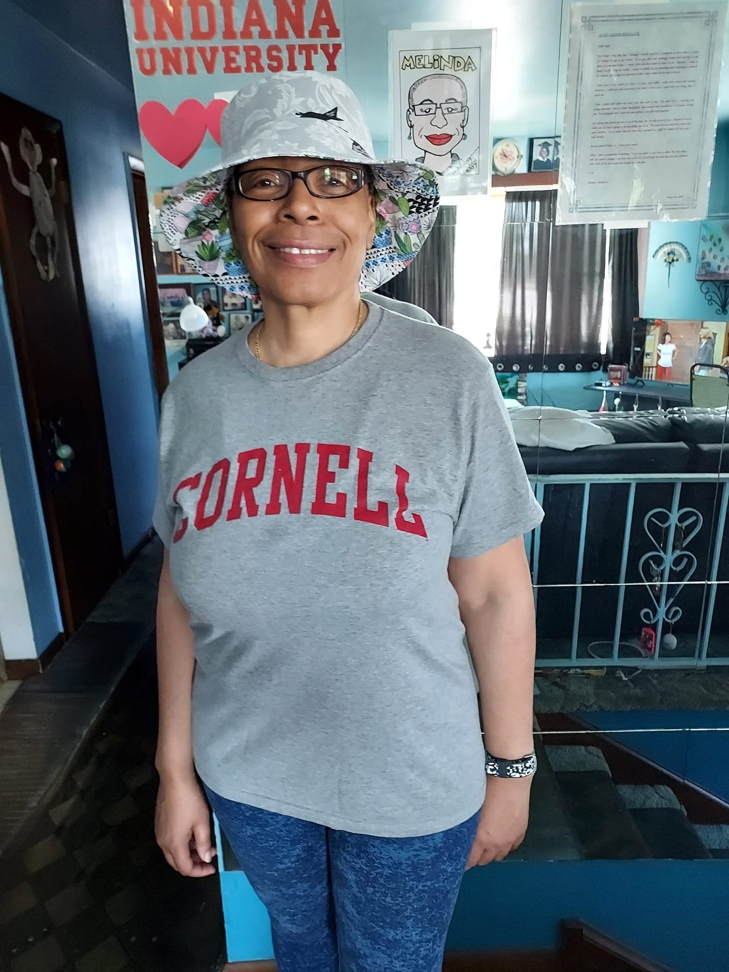 Woman in Cornell t-shirt and hat - clovis4
