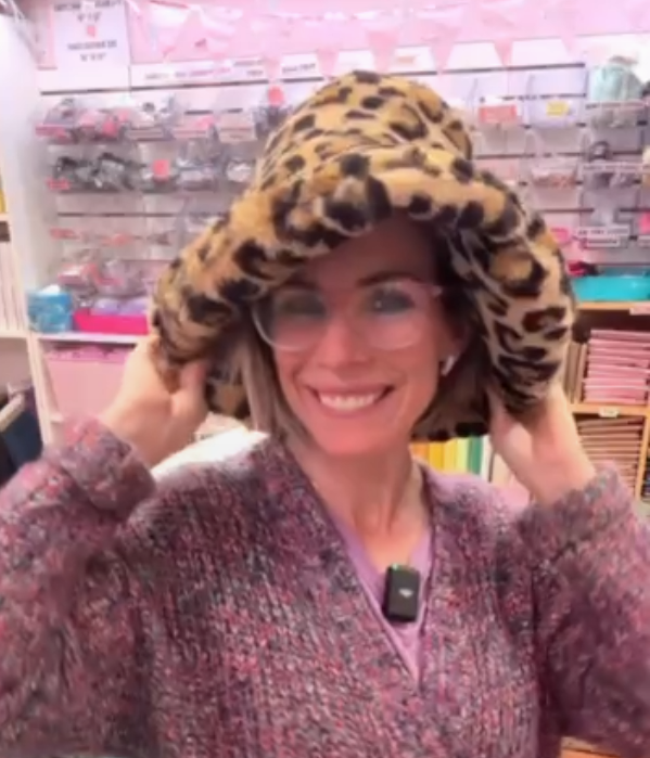 Woman in leopard print hat, cuddlebardothat style.