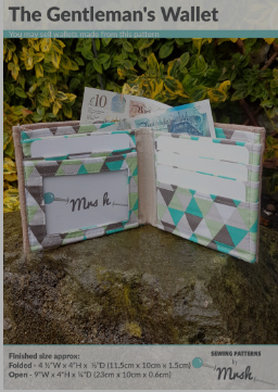 The Gentleman's Wallet open, showing money and card slots.