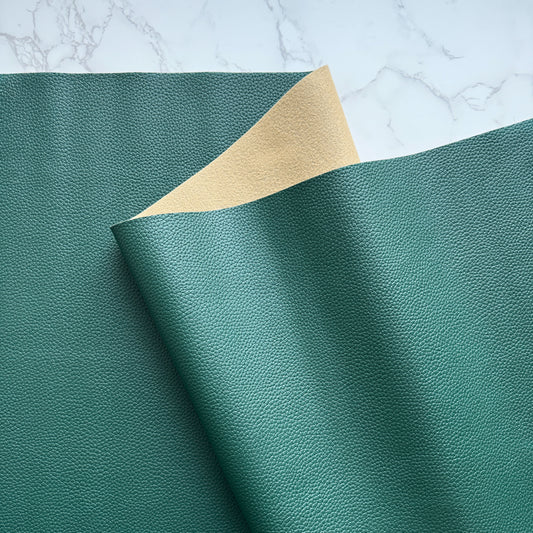 Hunter green faux leather vinyl fabric with moonglow effect