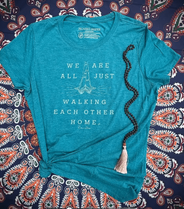 Teal shirt walking each other home with prayer beads