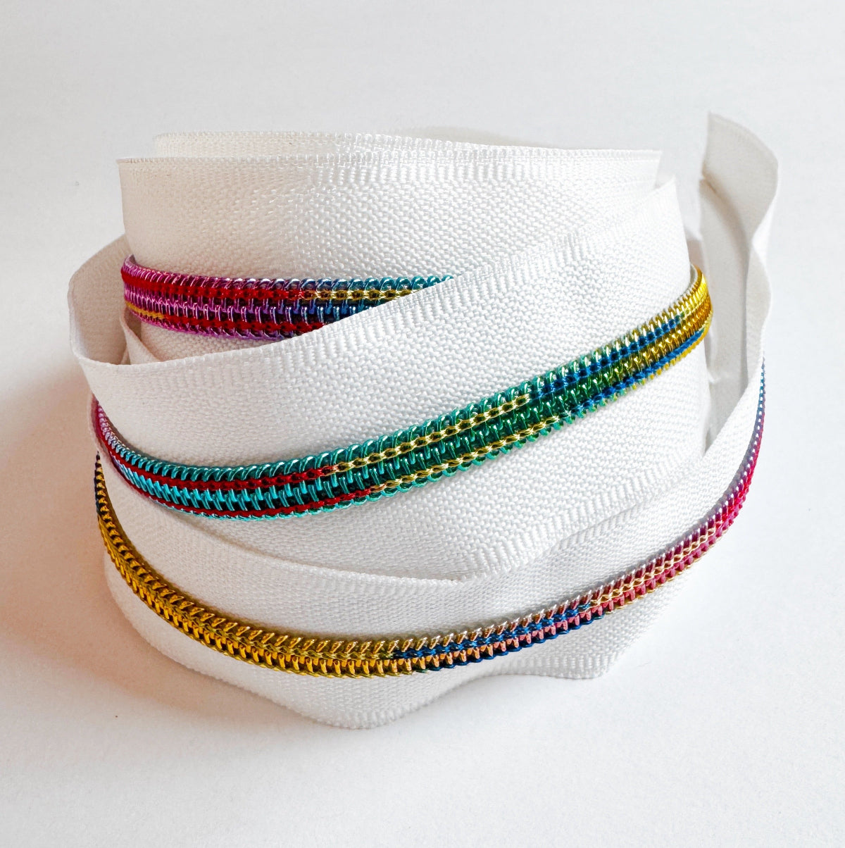zipper tape coiled up on a white background