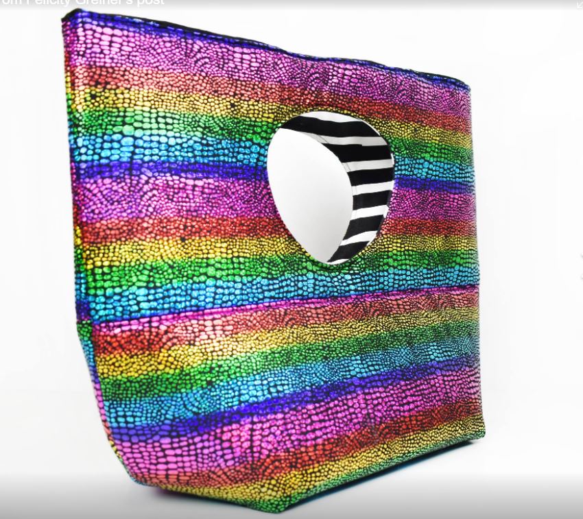 Felicity's rainbow tote bag with black and white interior.