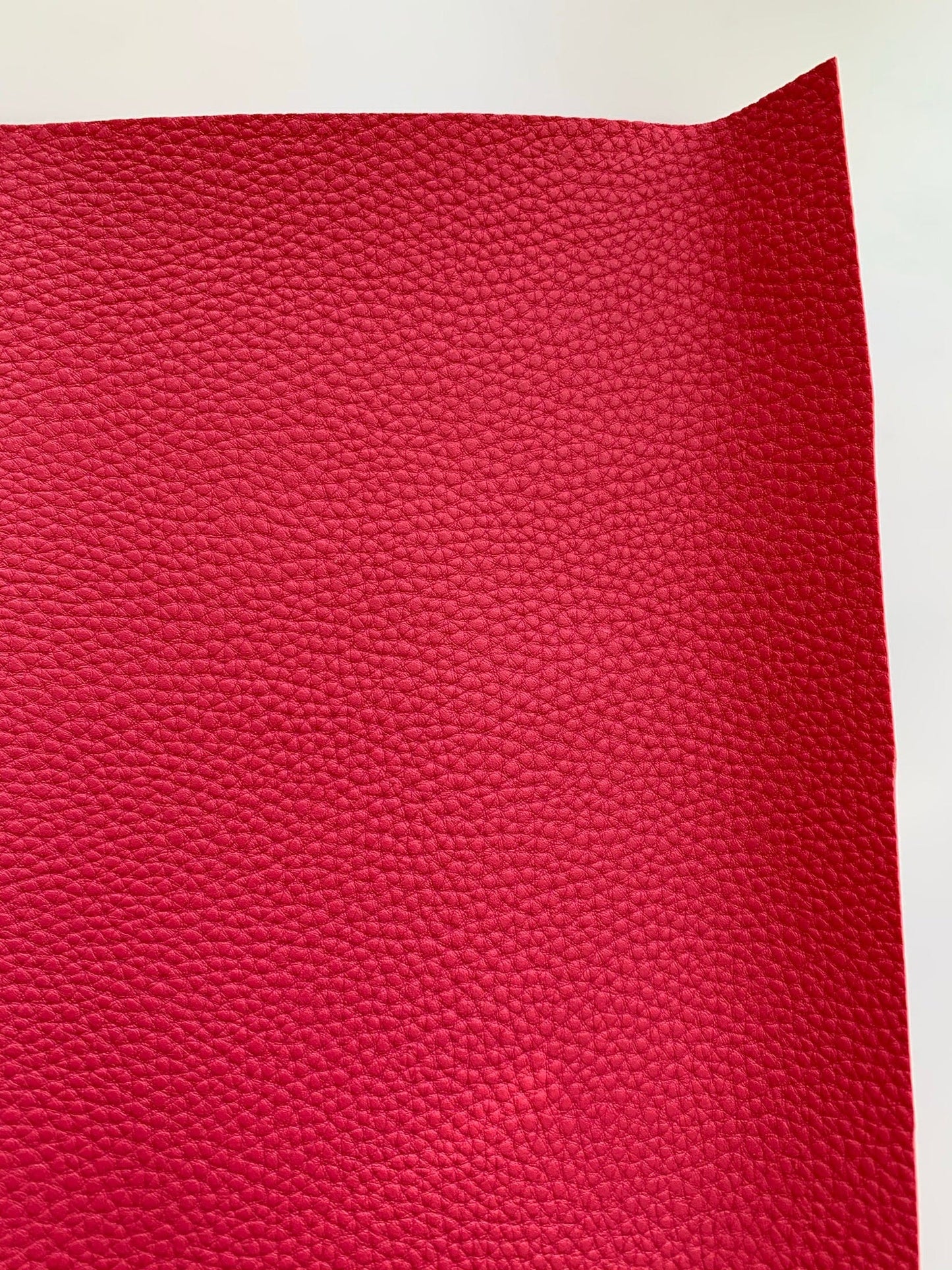 Red textured leather sheet.