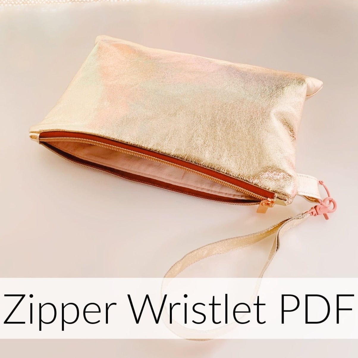 Gold zippered wristlet