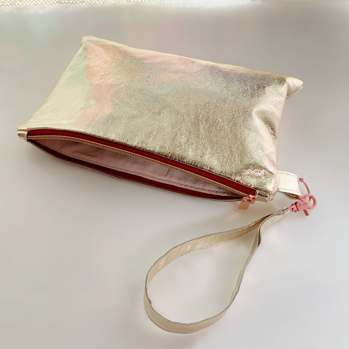 Gold clutch with wrist strap