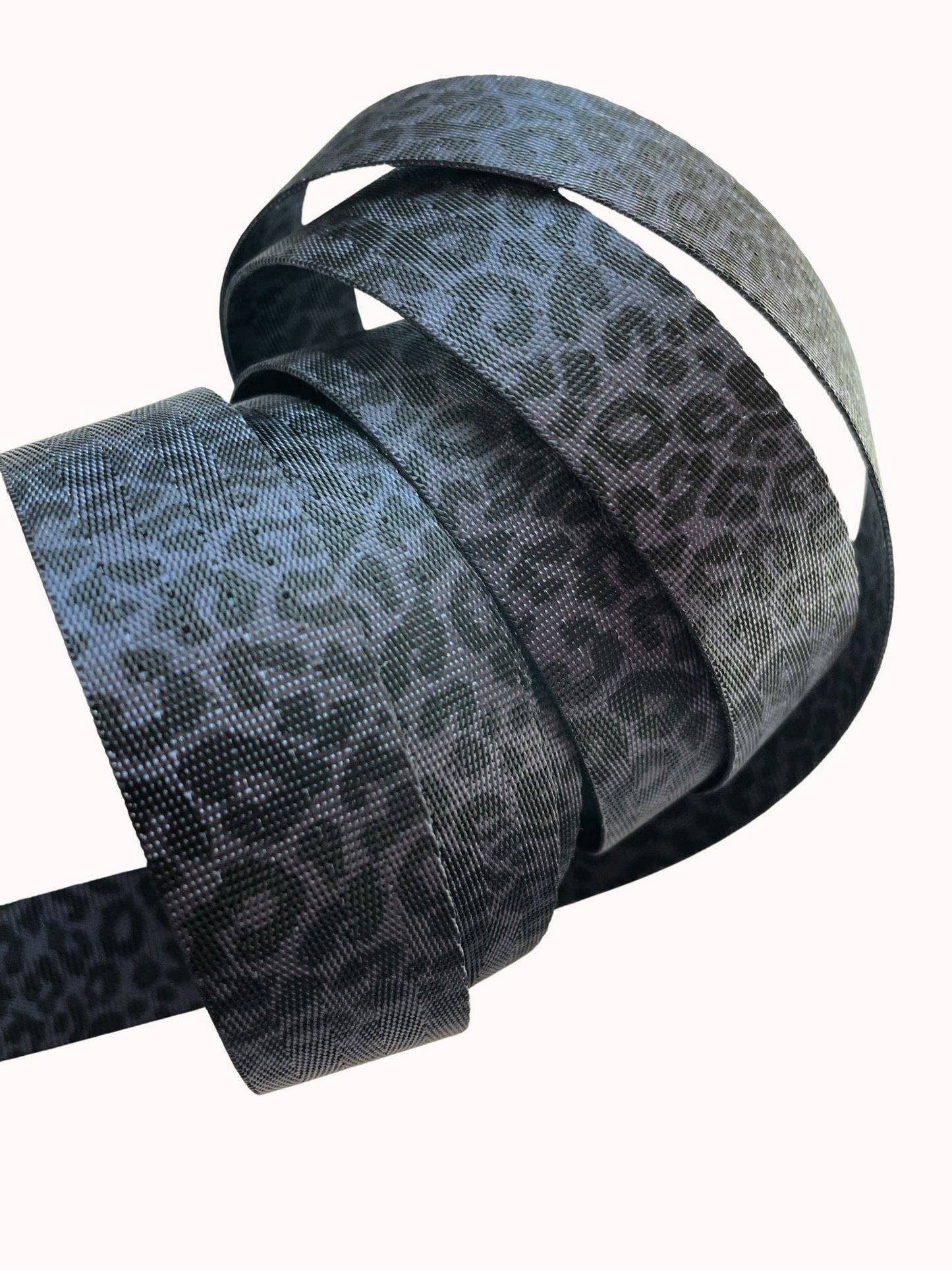 Rolled ribbon with gray leopard print.
