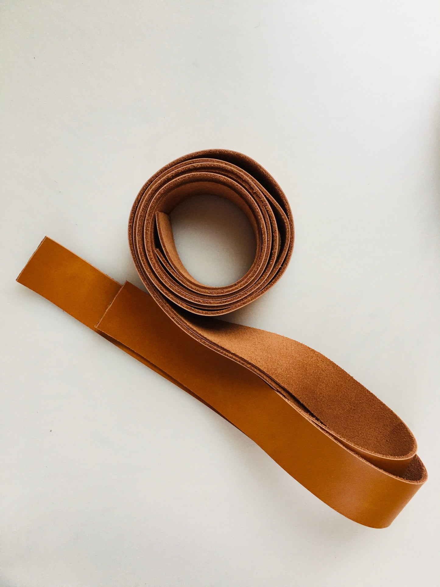 Brown leather strap rolled up