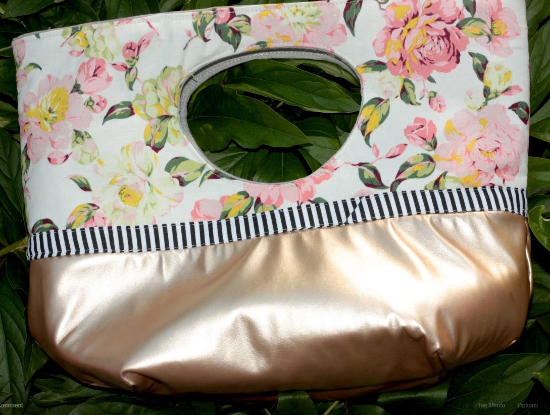 Laci Hess floral handbag with gold satin base.
