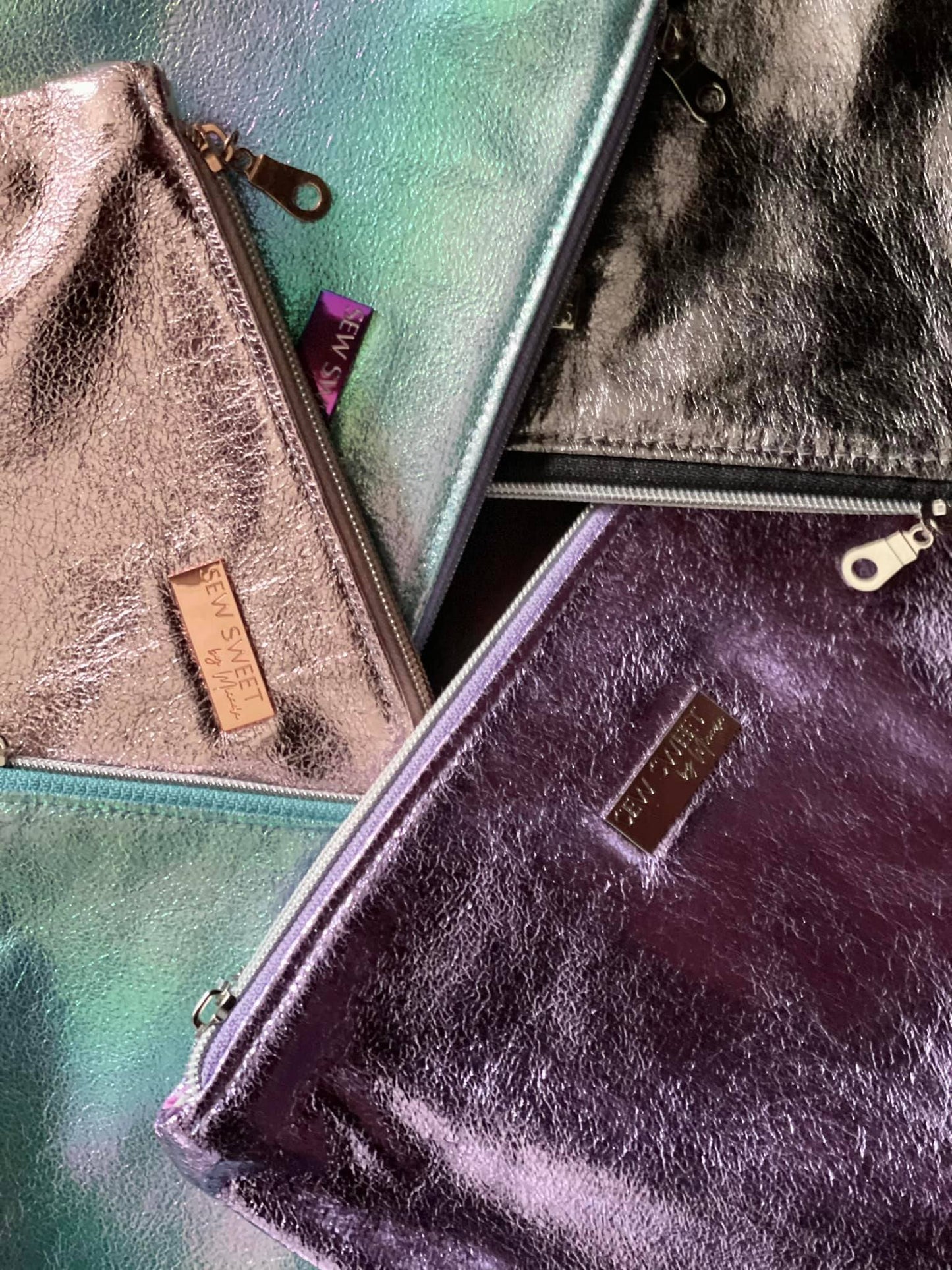 Micaela's collection of metallic clutches