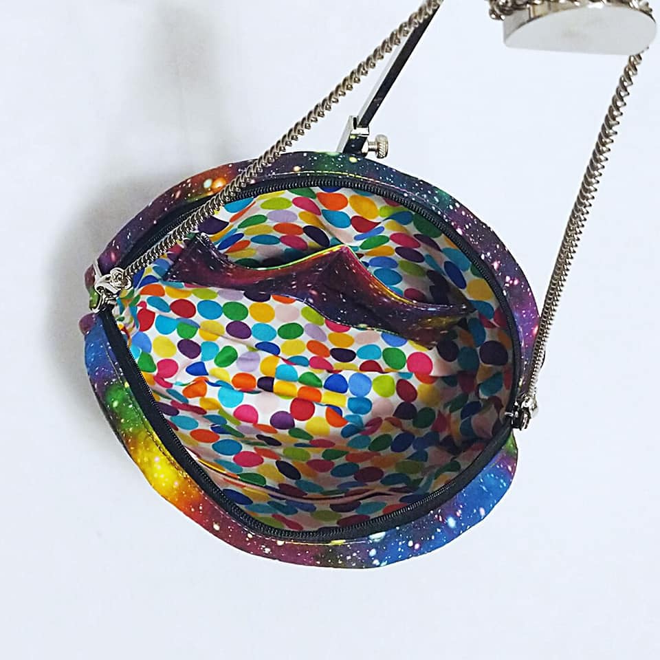 Michelleg3's galaxy purse with colorful polka dot lining
