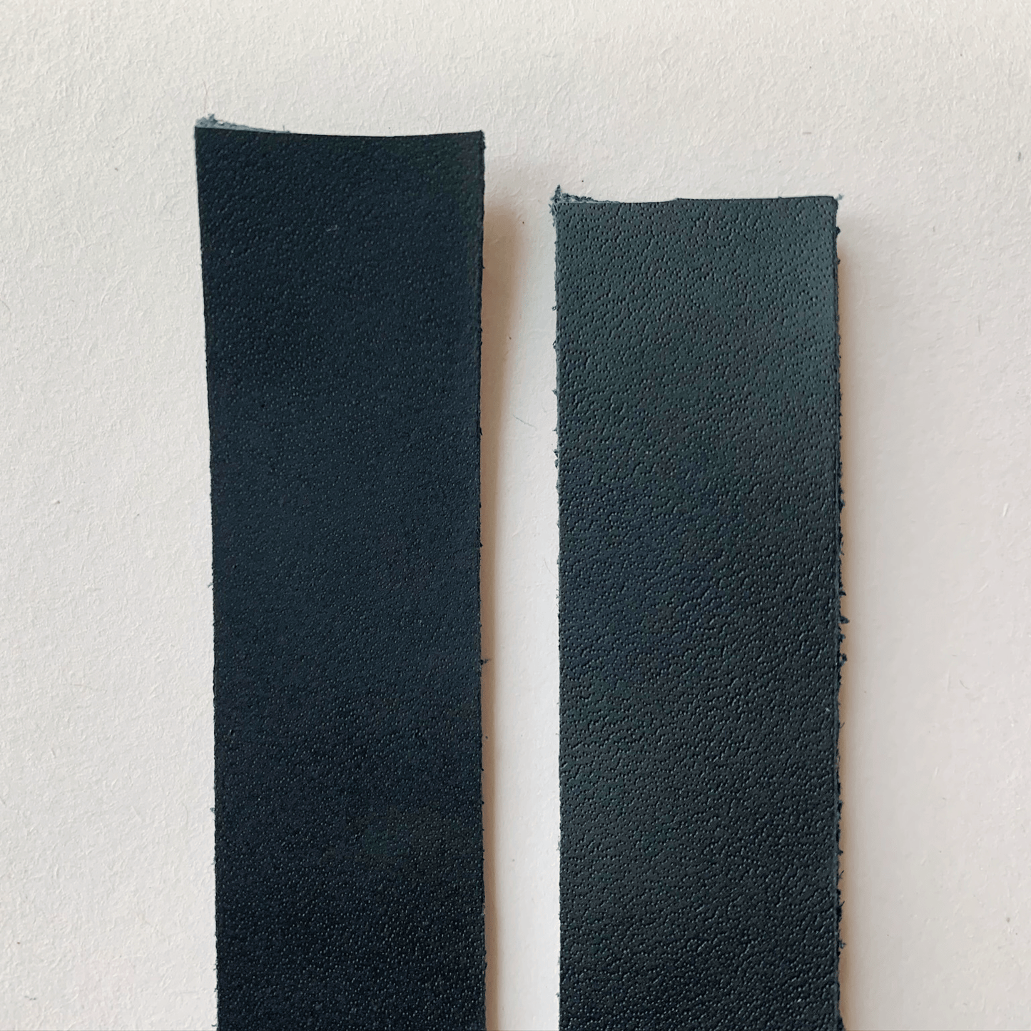 Black leather strap samples, close-up