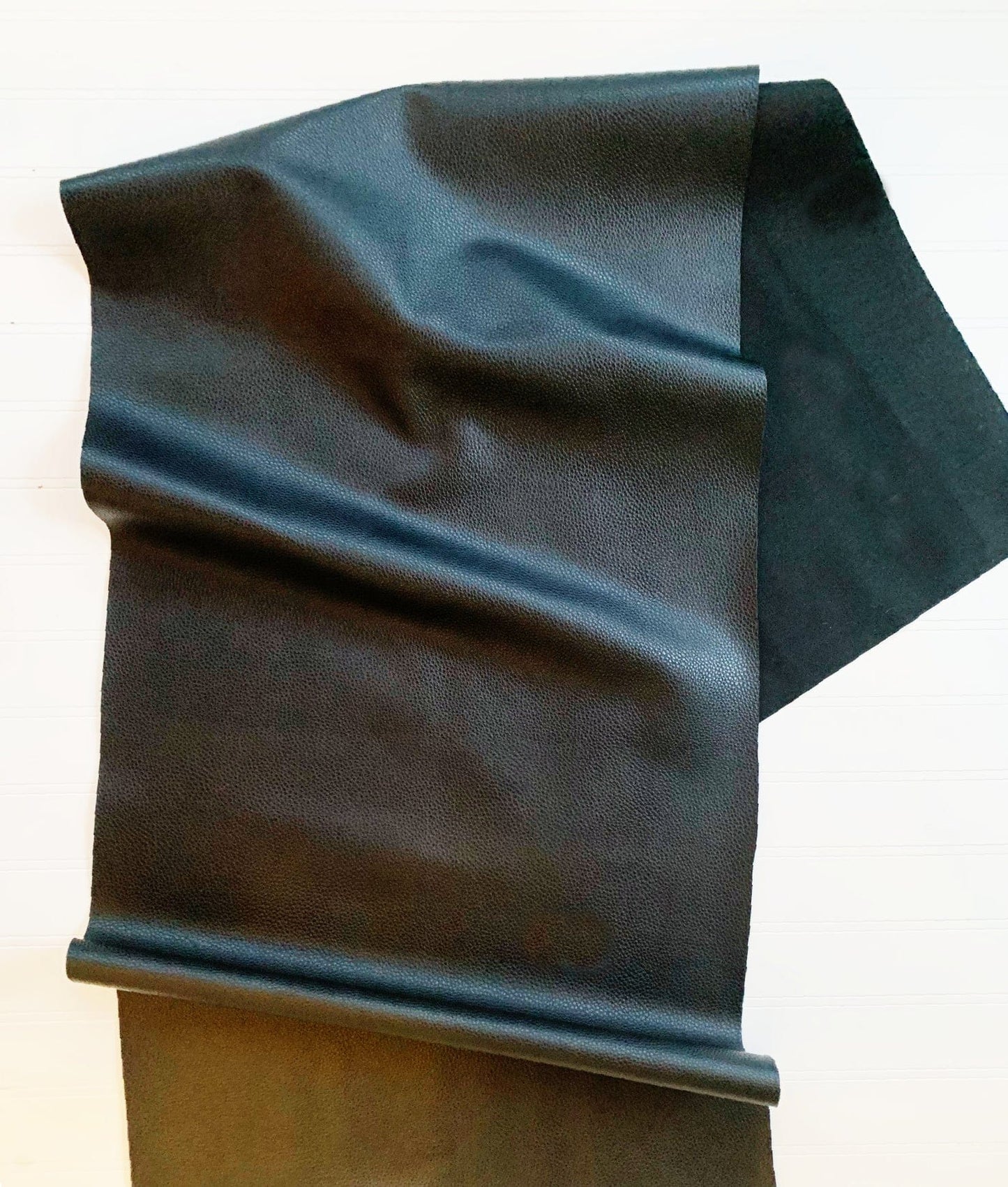 Black vinyl faux leather fabric roll