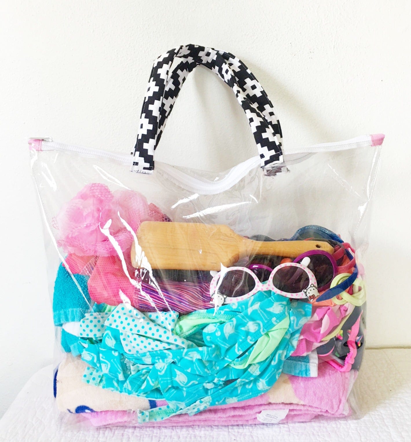 Clear vinyl bag filled with beach items