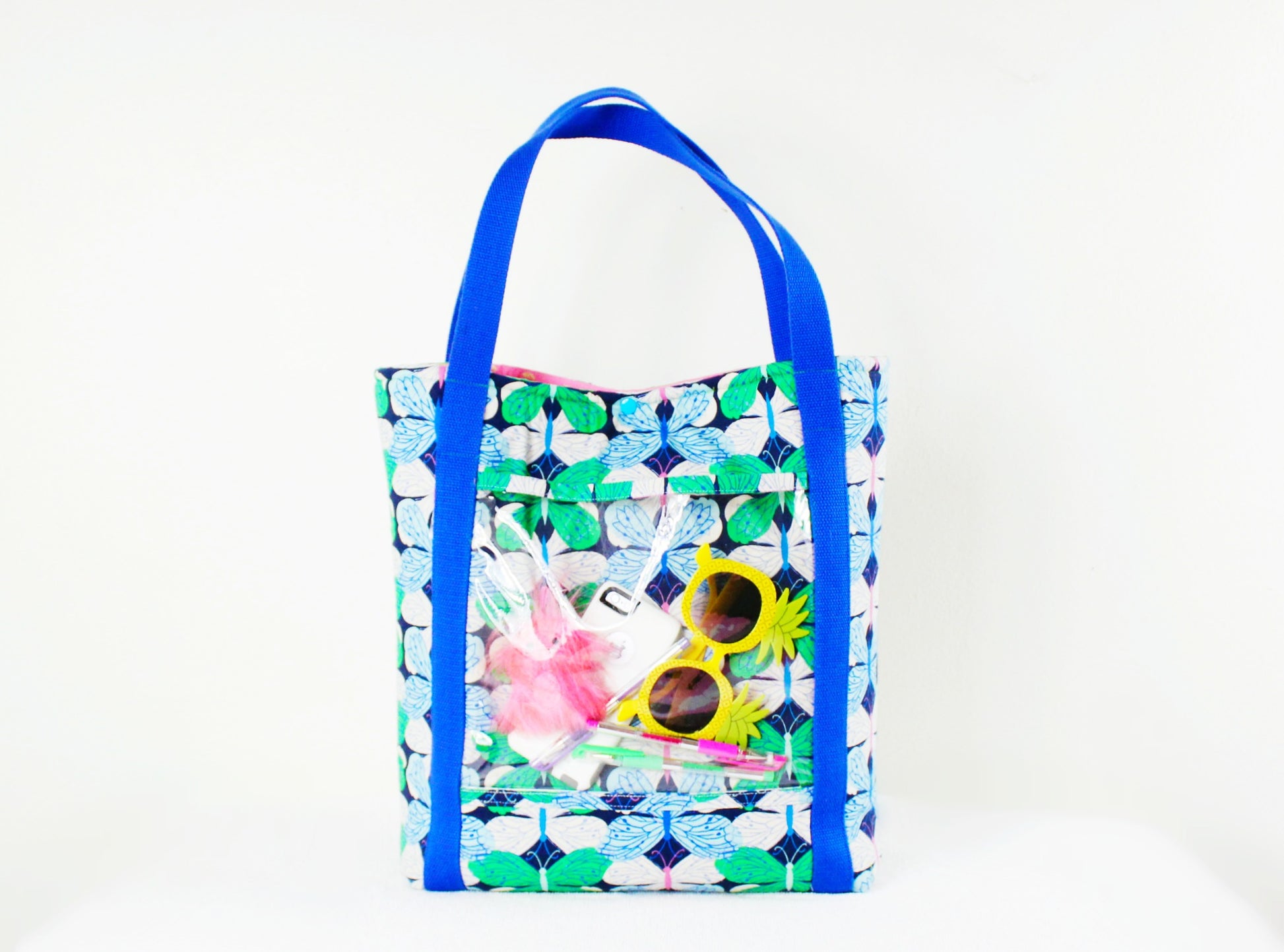 Blue handle tote bag with sunglasses