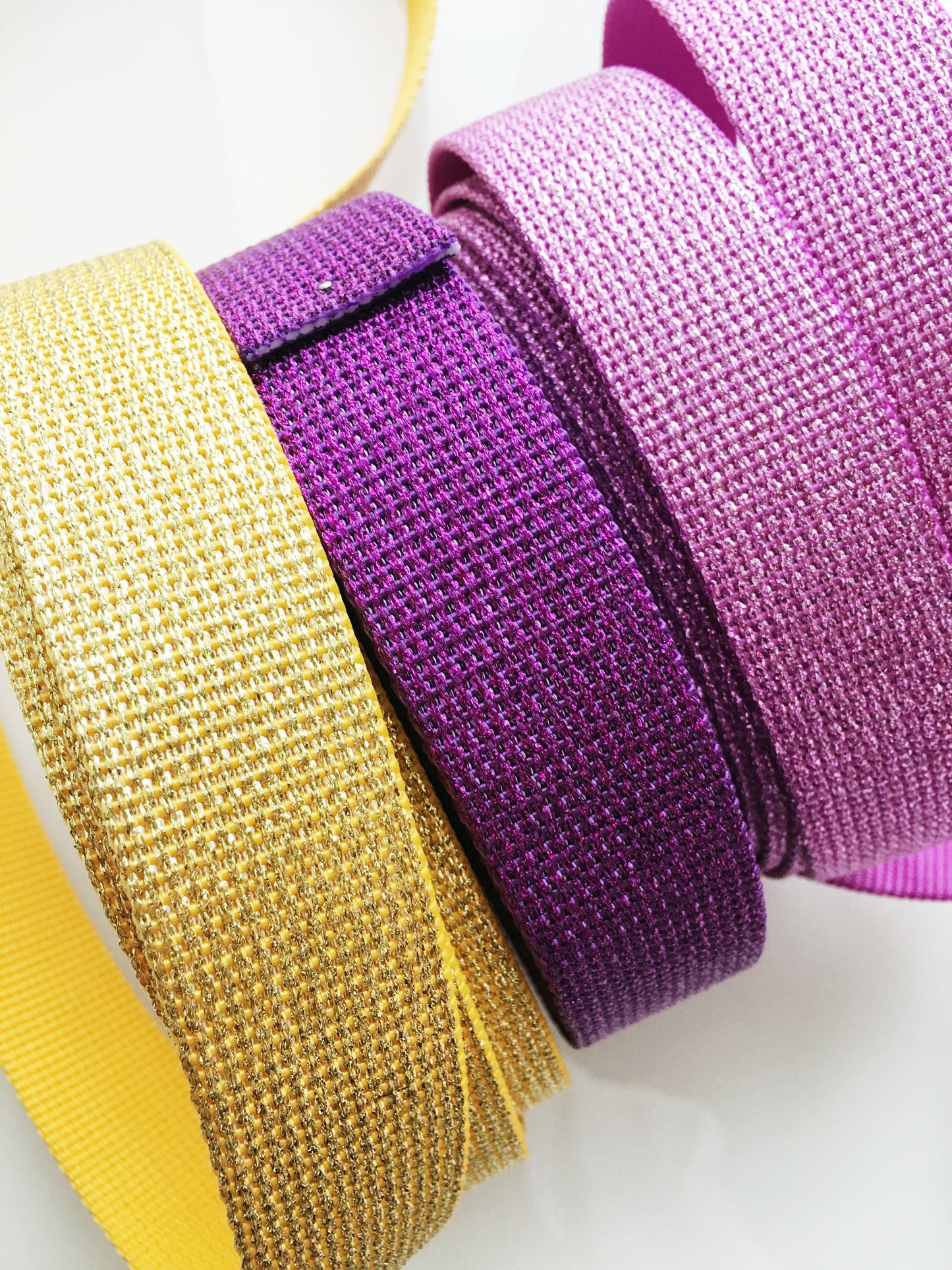 Glitter straps in gold, purple, and pink.