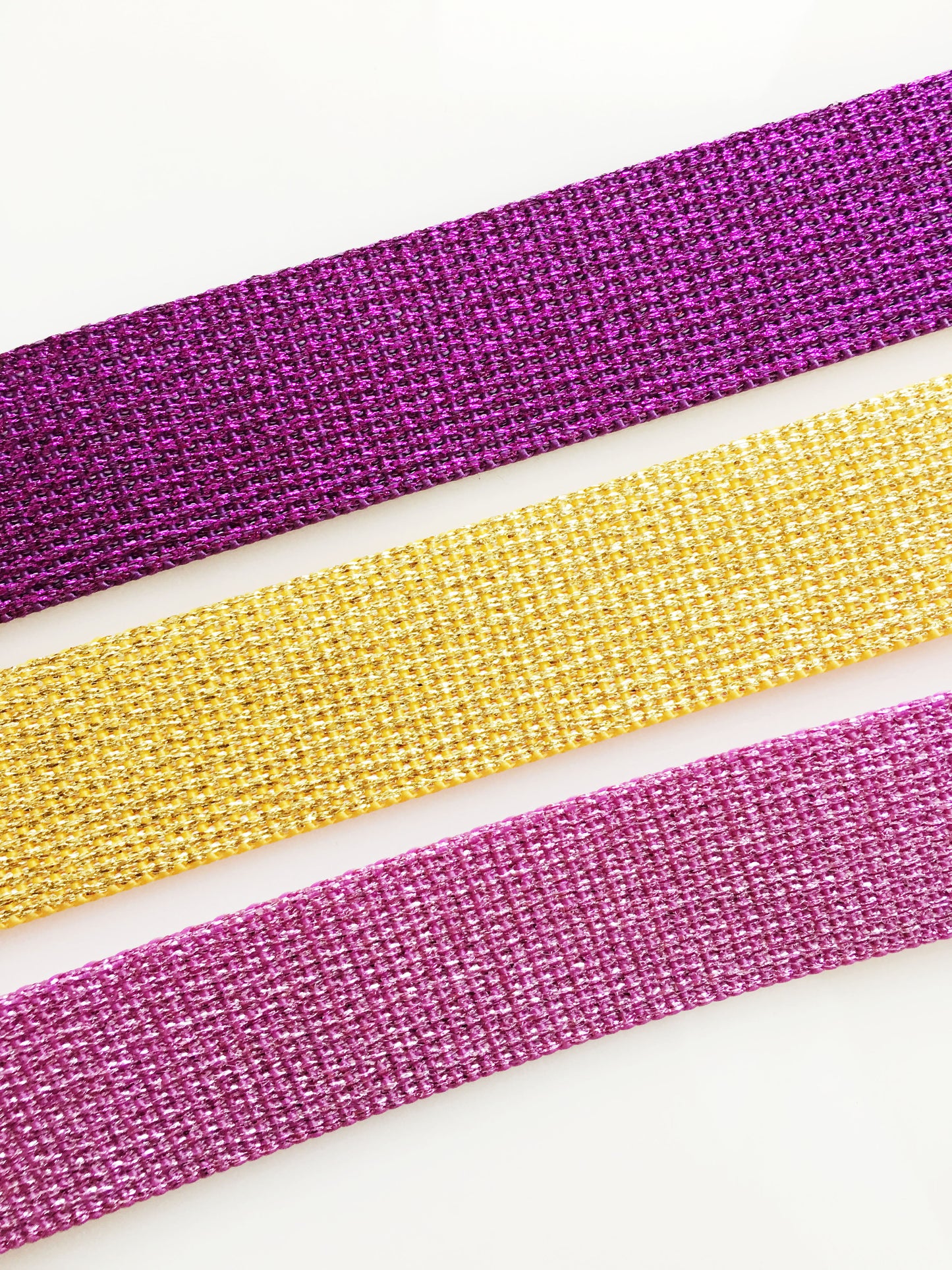 Glitter webbing in purple, gold, and pink.