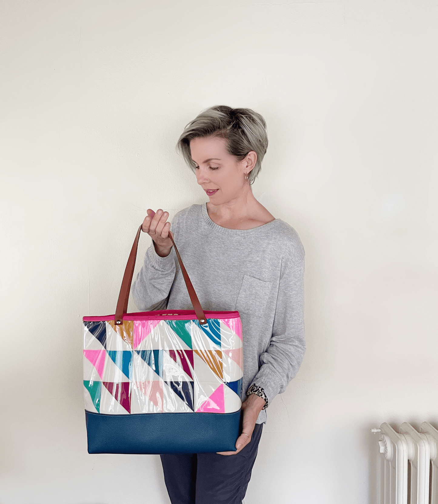 Woman holding colorful geometric hstbag4 tote bag