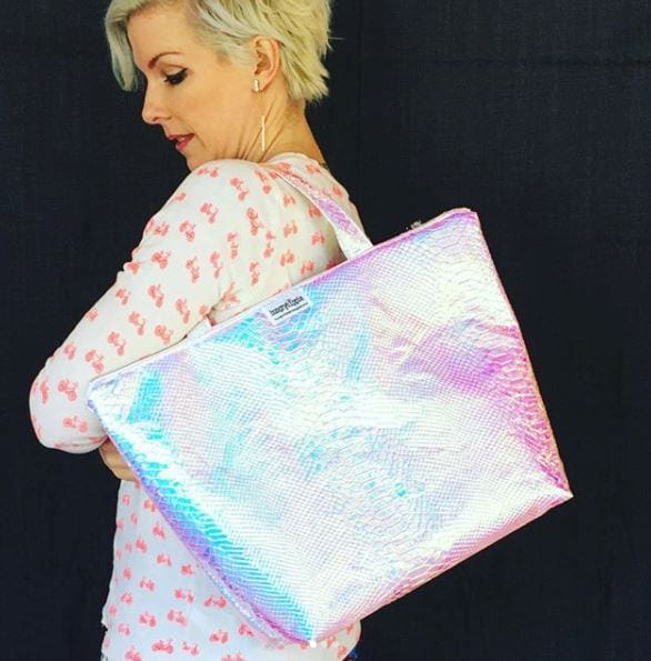 Woman with iridescent tote bag