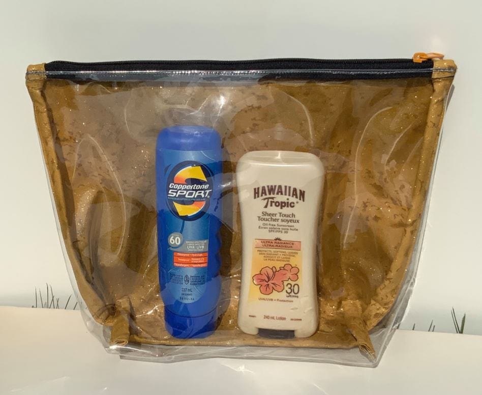 Sunscreen bottles in travel bag