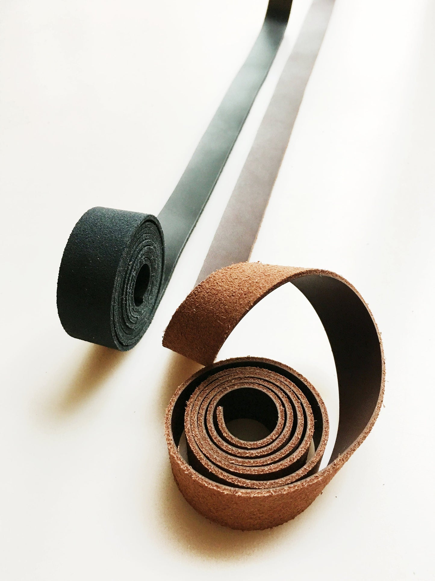 Leather strap rolls by bag maker
