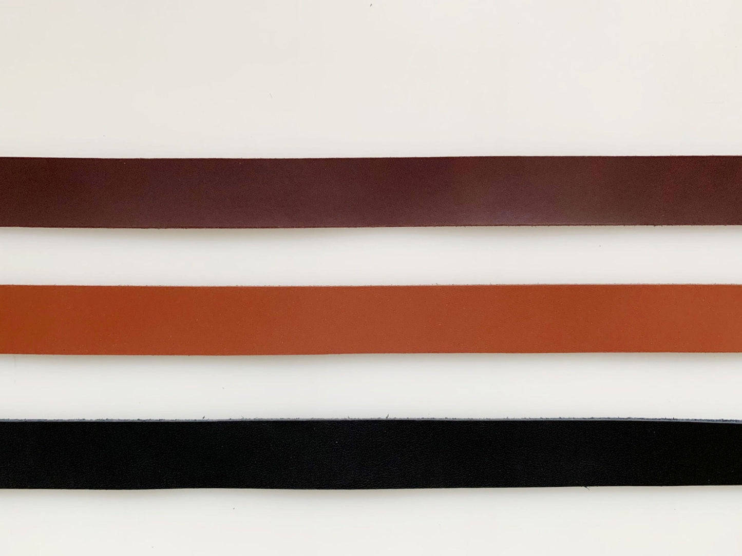 Leather straps in brown, tan, and black