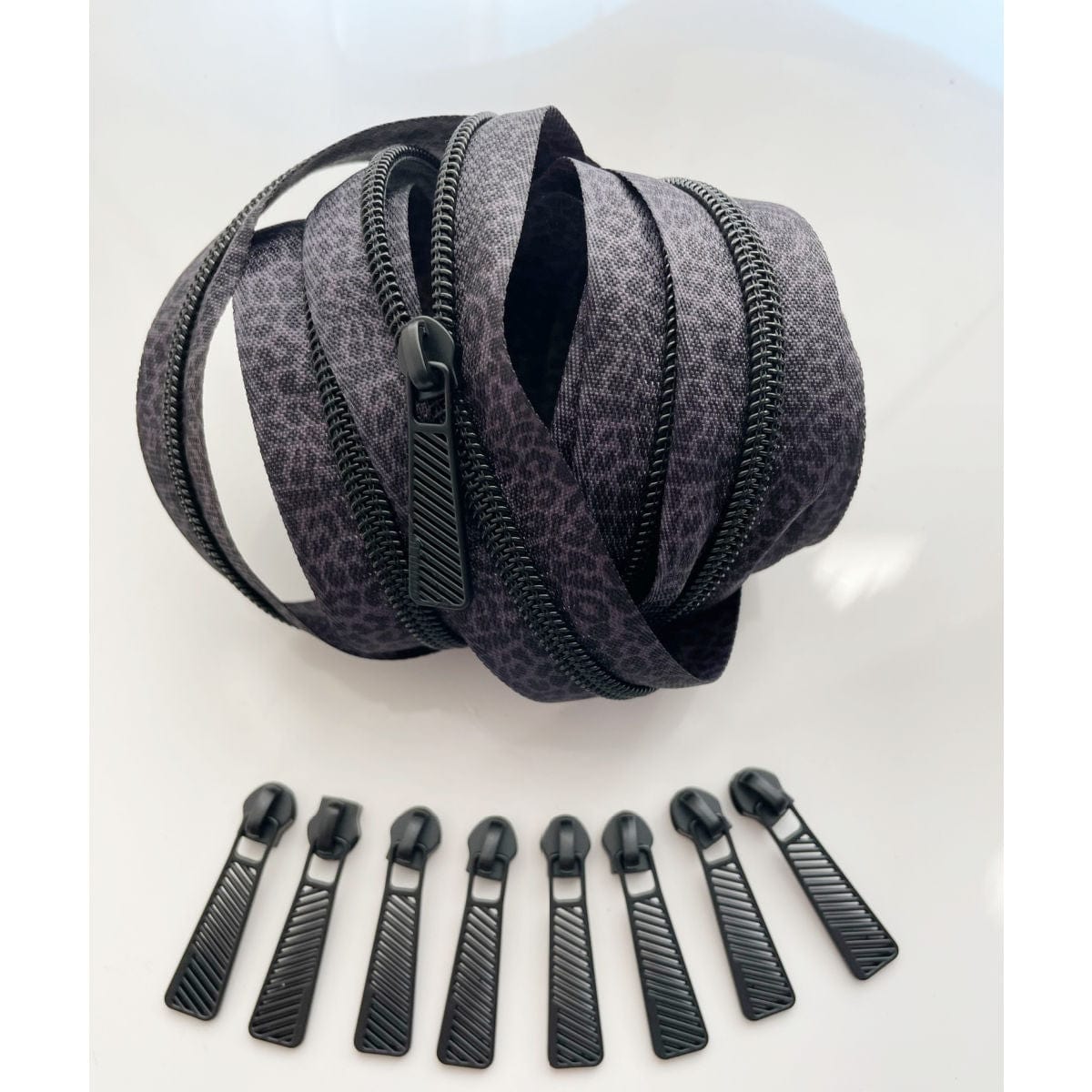 Black and grey leopard print zipper with zipper pulls