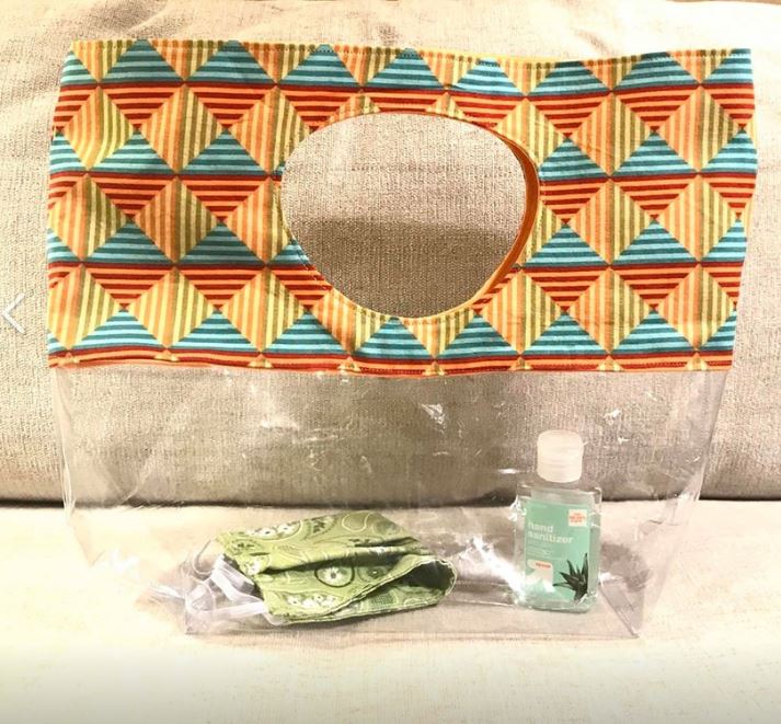 Madeliene's clear tote bag with mask and sanitizer