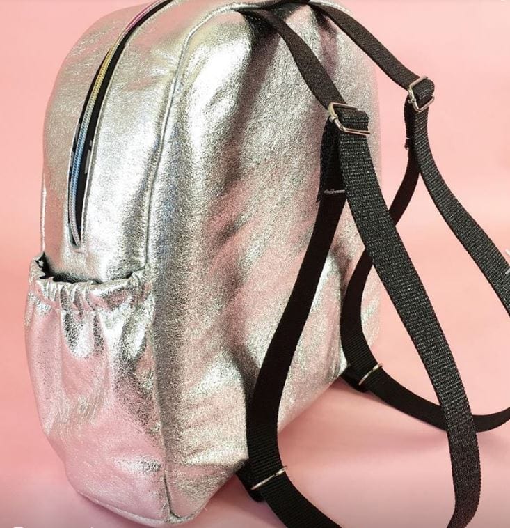 Silver backpack with black straps